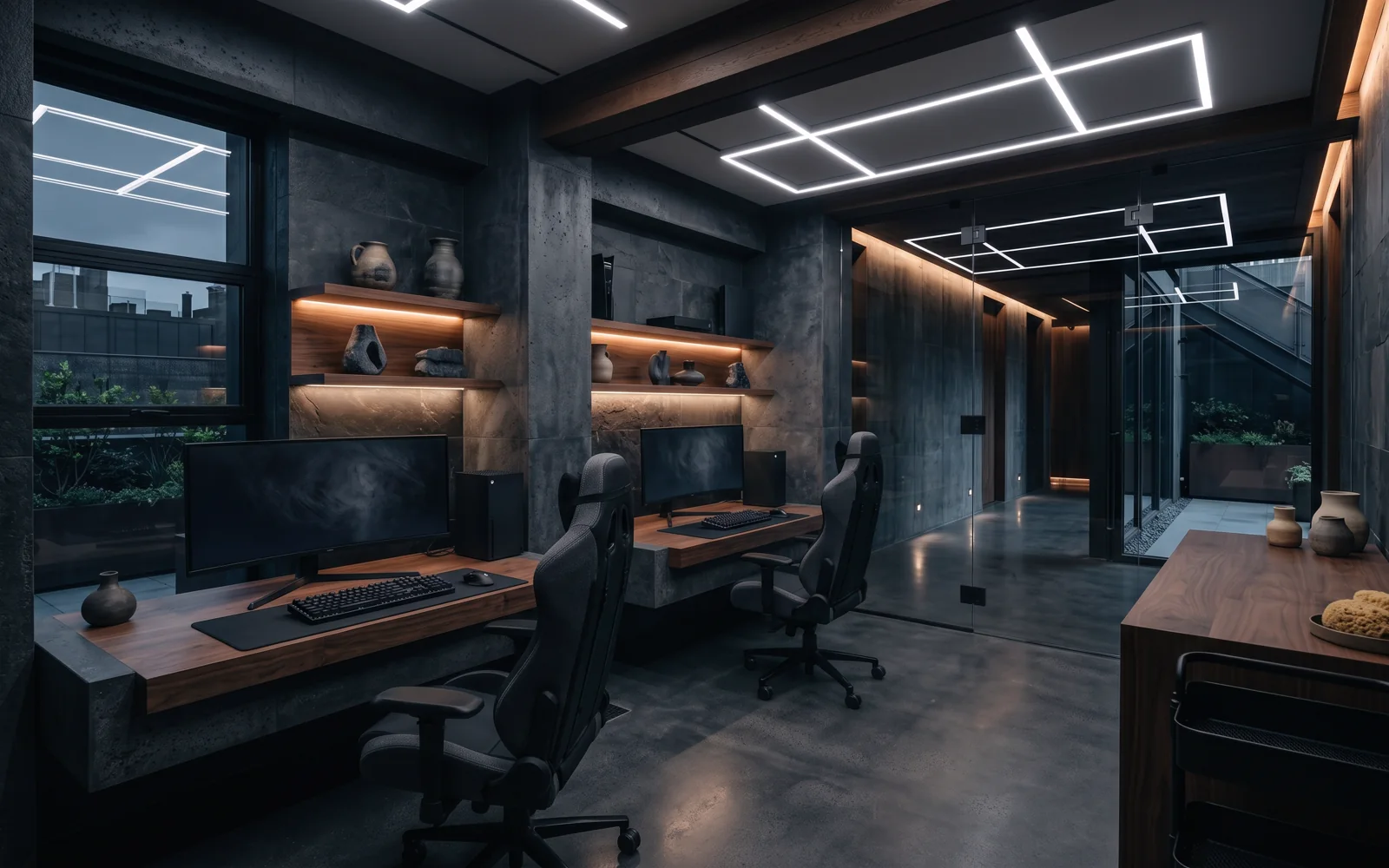 Sala de videojuegos con dos estaciones, sillas gamer y monitores curvos