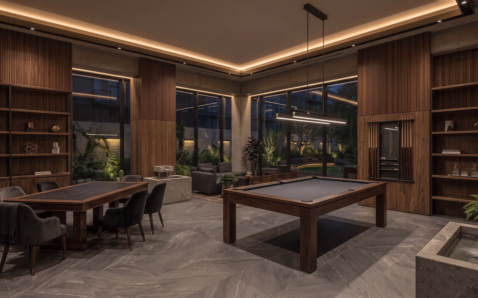 Sala de juegos con futbolito y mesa de juegos en madera de nogal y acero mate
